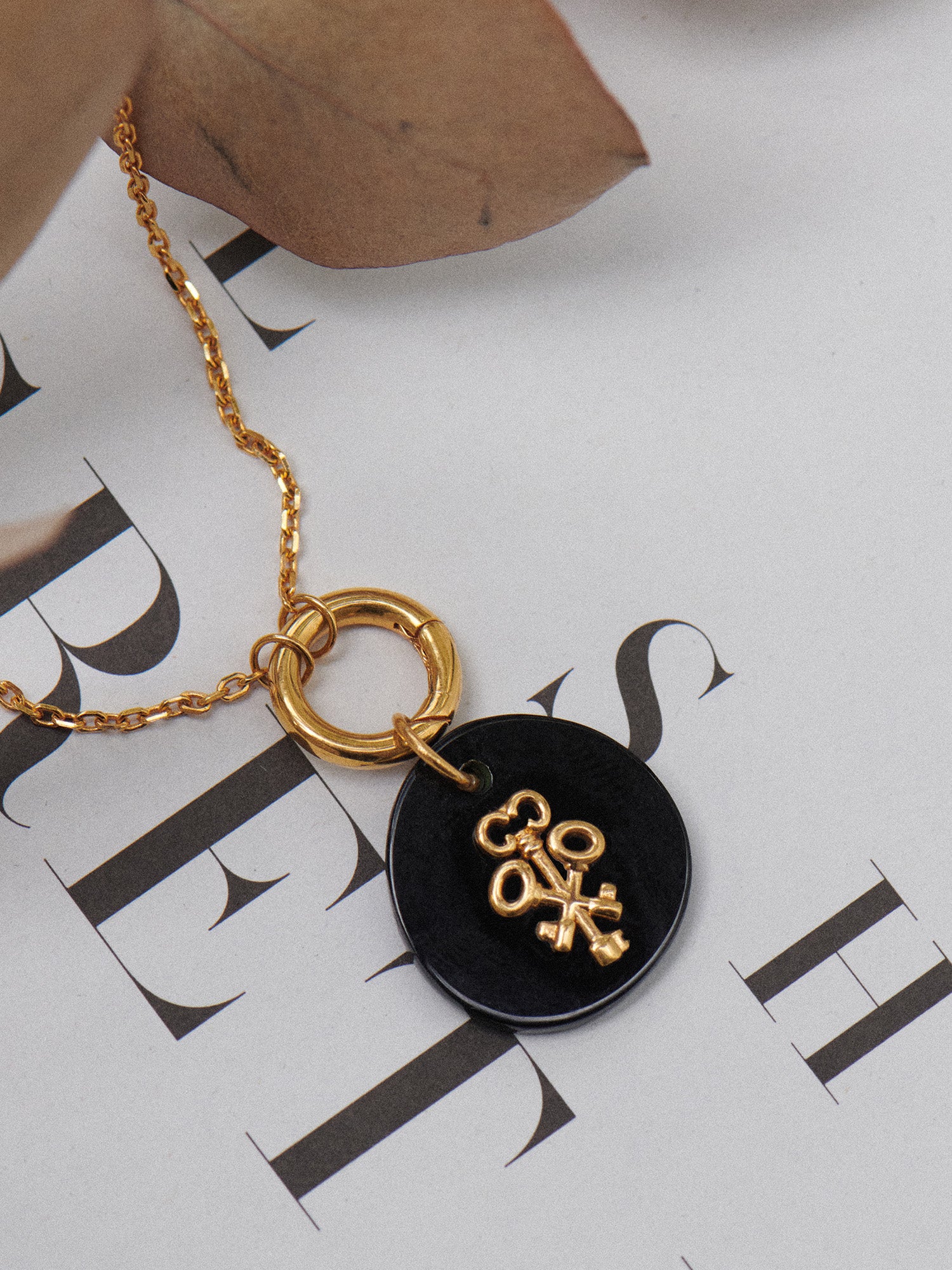 Black Onyx Keys Gold Pendant